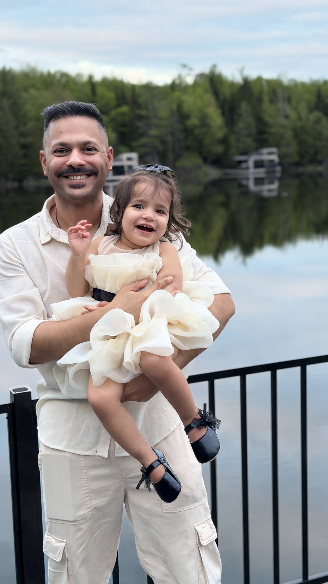 Father and daughter by the lake